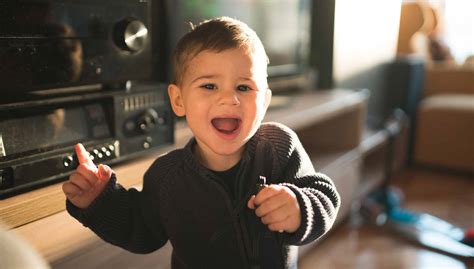 When Do Babies Dance, and What Triggers Their First Moves to the Rhythm of Life?